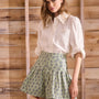 Stretch sateen pleated shorts with a banded waist in Navy Bird Block print.