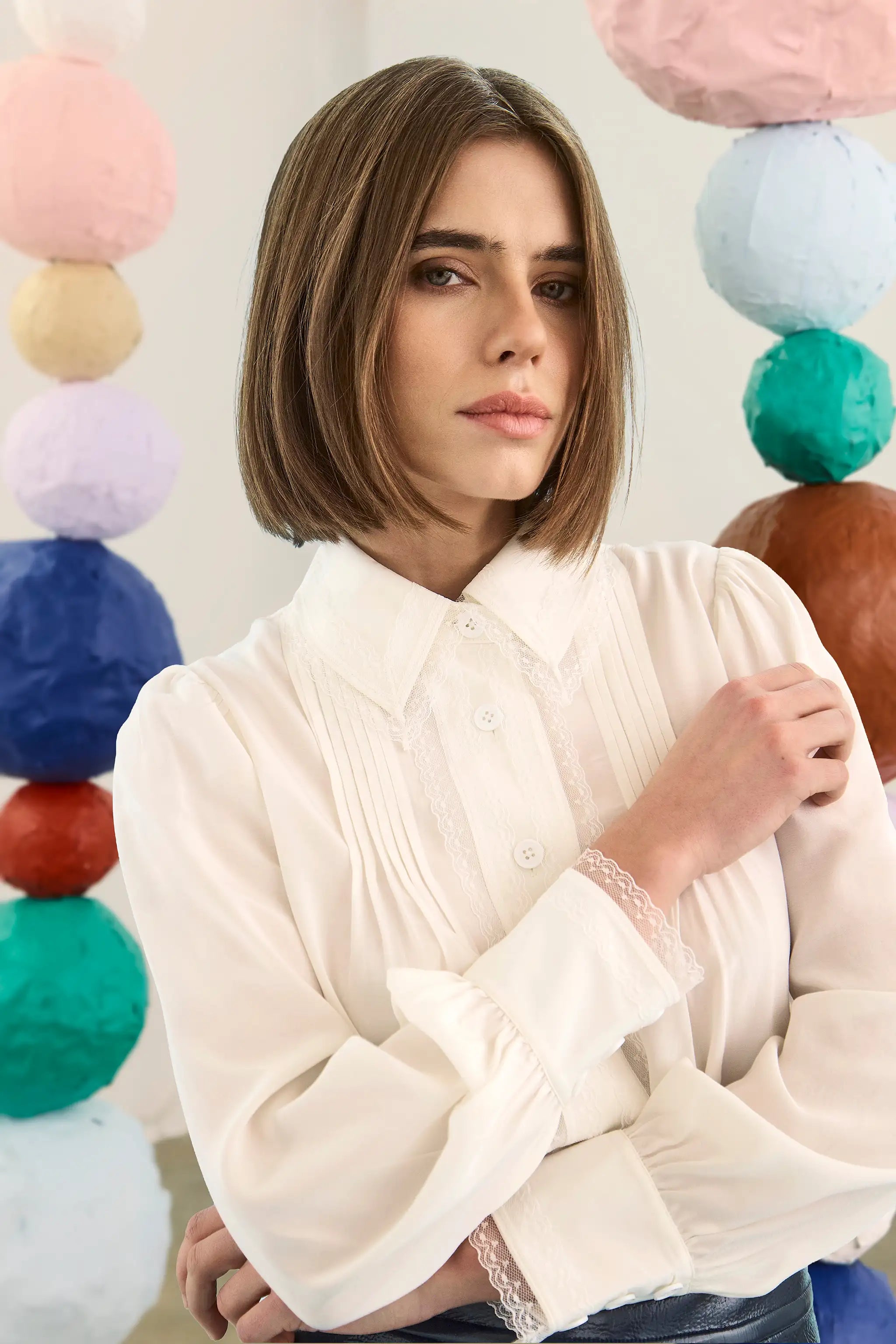 The James Shirt in Ivory paired with the Meeghan Mini Skirt in Navy. 