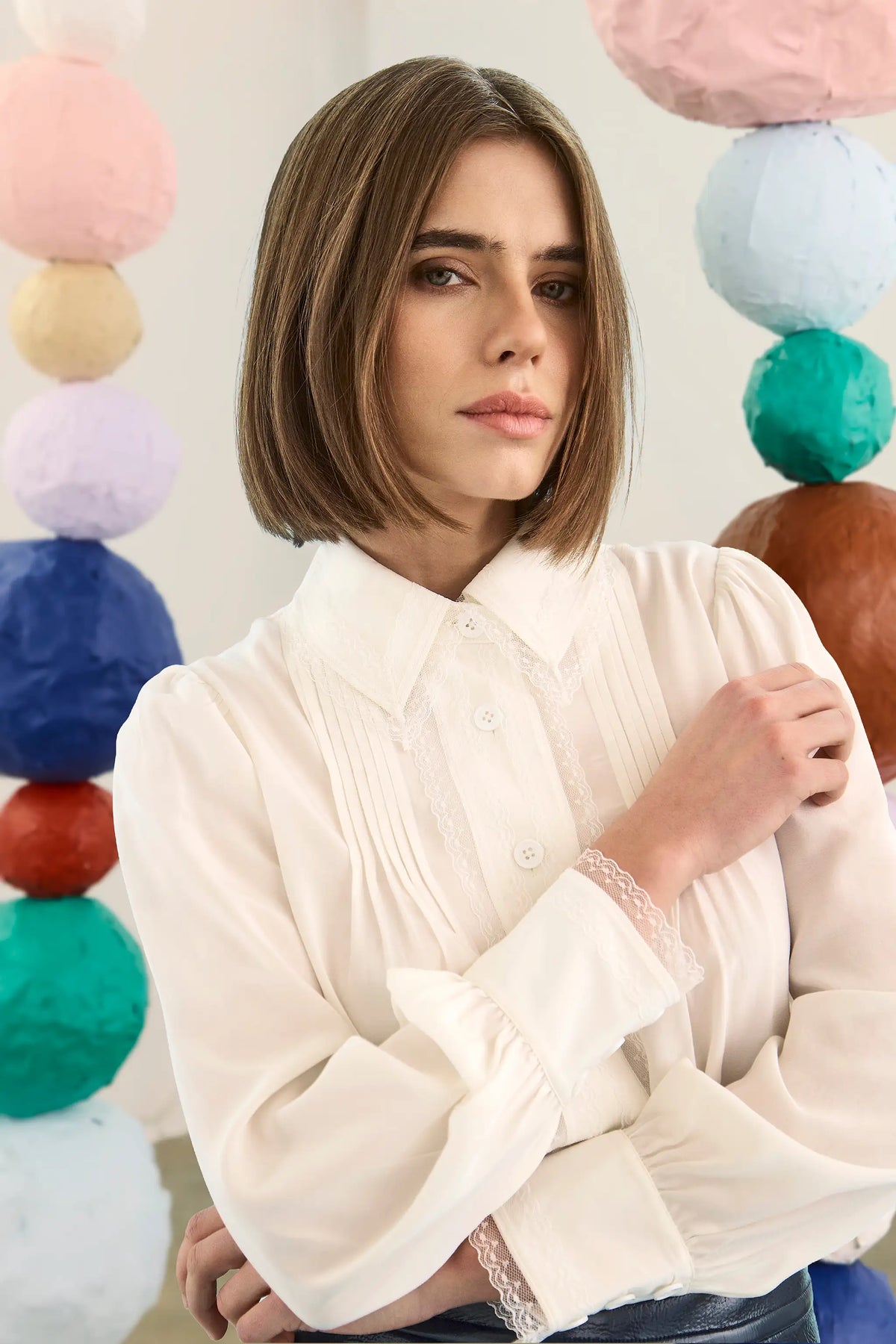 The James Shirt in Ivory paired with the Meeghan Mini Skirt in Navy. 