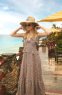 The Jamison Dress in Berryvine paired with HB x Freya straw hat.