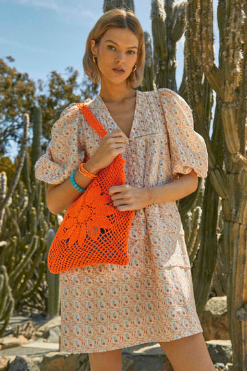 Neon tote bag, hand crocheted in Bolivia by local artisans.
