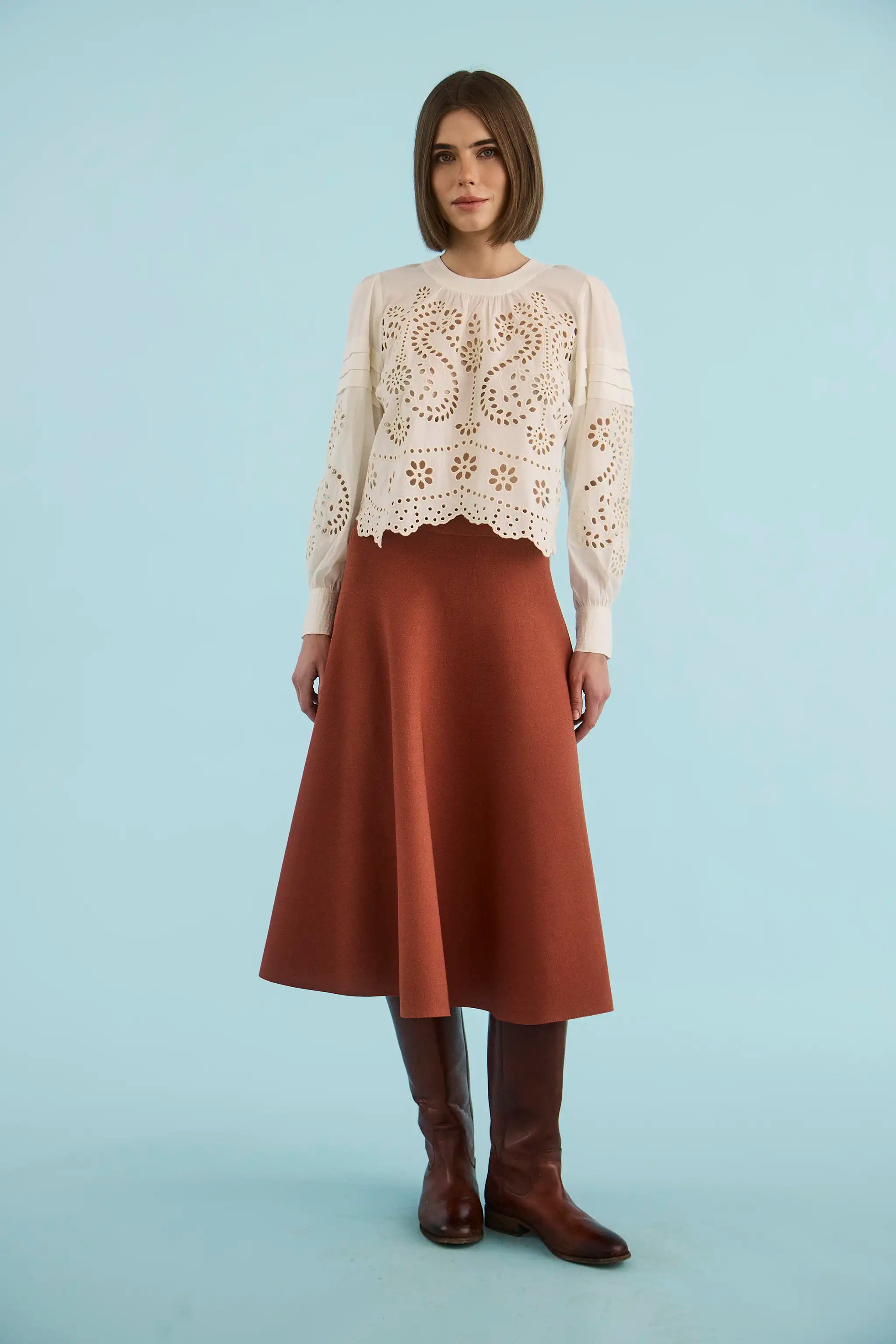 The Jennifer Top in Ivory paired with the Joan Skirt in Rust. 