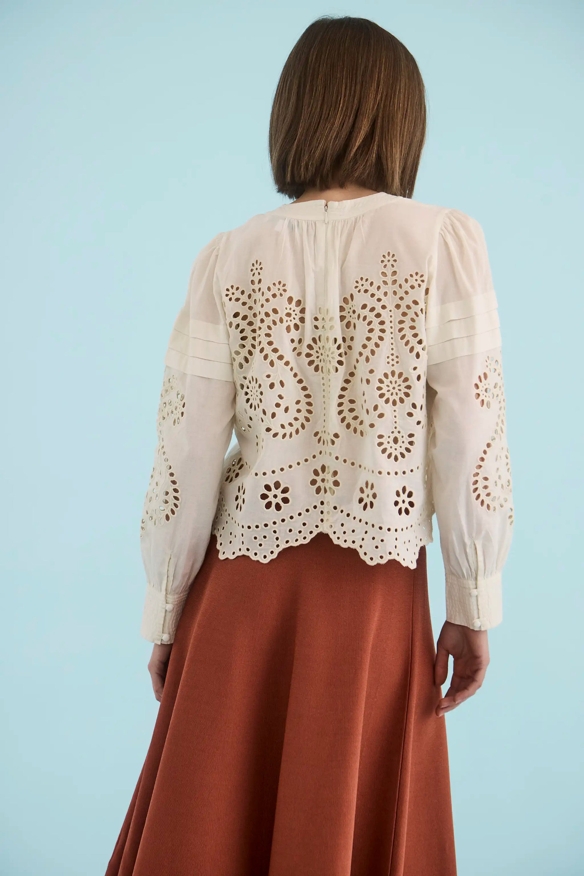 The Jennifer Top in Ivory paired with the Joan Skirt in Rust. 