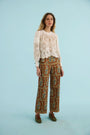The Jennifer Top in ivory paired with the Juno Pant in Amber Glen Brown. 