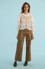 The Jennifer Top in ivory paired with the Juno Pant in Amber Glen Brown. 