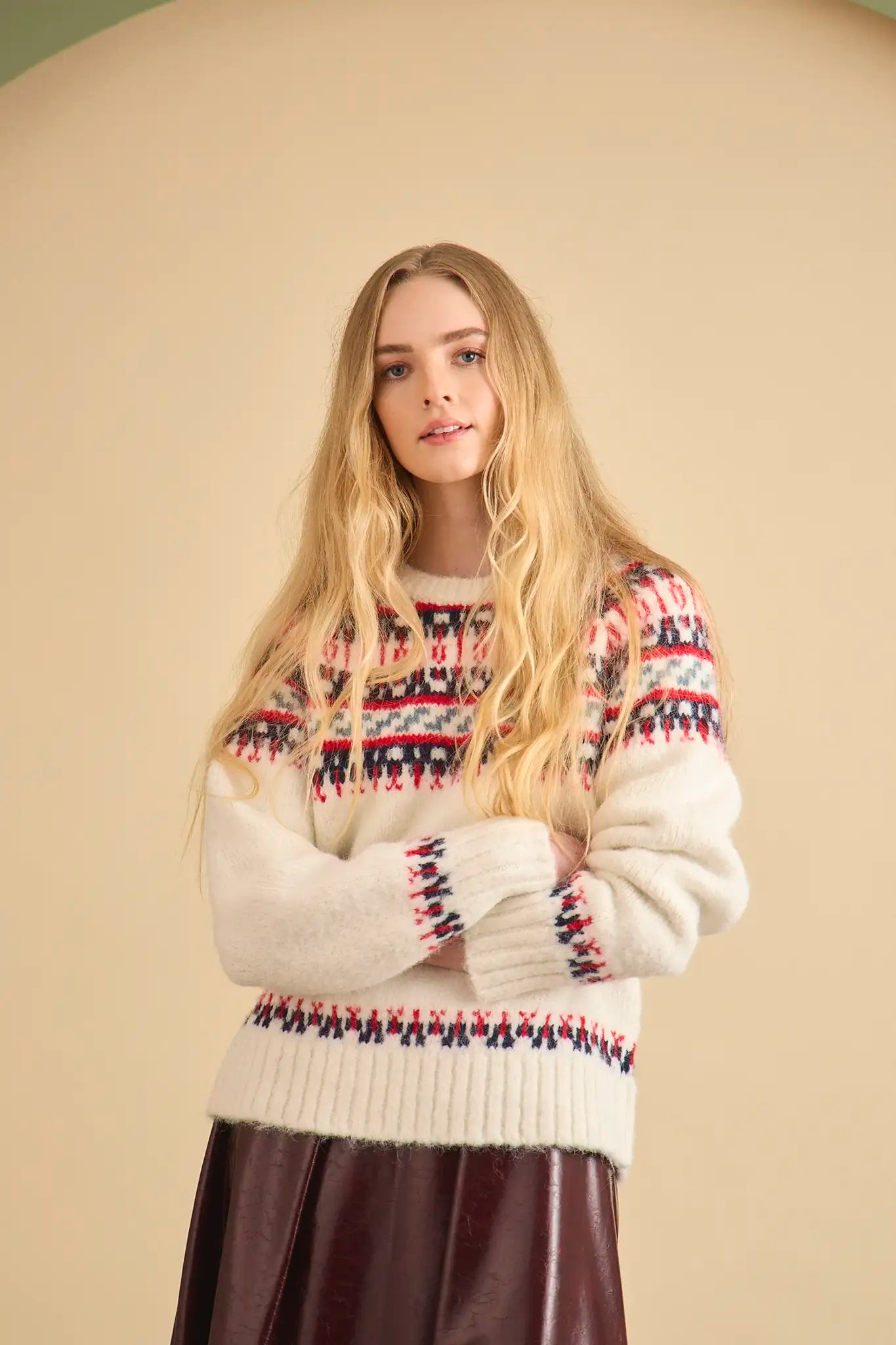 The Josie Sweater in Cream Fairisle has a ribbed crew neckline and long raglan sleeves.