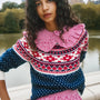The Josie Sweater in St. Moritz Fair Isle has a ribbed crew neckline and long raglan sleeves.
