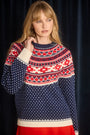 The Josie Sweater in St. Moritz Fair Isle has a ribbed crew neckline and long raglan sleeves.
