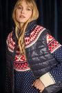 The Brady Vest is a elevated puffer with a collared neckline and a knitted Fair Isle yoke.