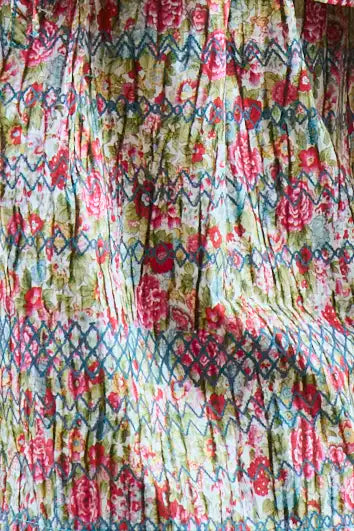 These Lura Shorts have a smocked waist and adjustable tie, made with Liberty Fabric.