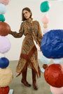 The Allyne Skirt in Amber Glen Brown paired with the matching Karis Blouse. 