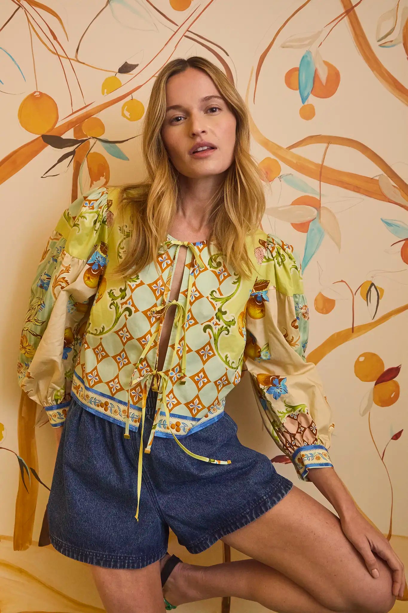 The Katie Top has a front tie closure, full balloon sleeves and a cropped, boxy profile.