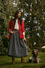 The Keegan Toggle Jacket in Fireside paired with the Finch Top in Ivory and the Queenby Skirt.