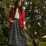 The Keegan Toggle Jacket in Fireside paired with the Finch Top in Ivory and the Queenby Skirt.