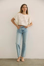 The Keira Top in White paired with denim.