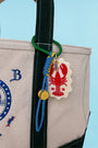 The Lobster Bag Charm on tote bag