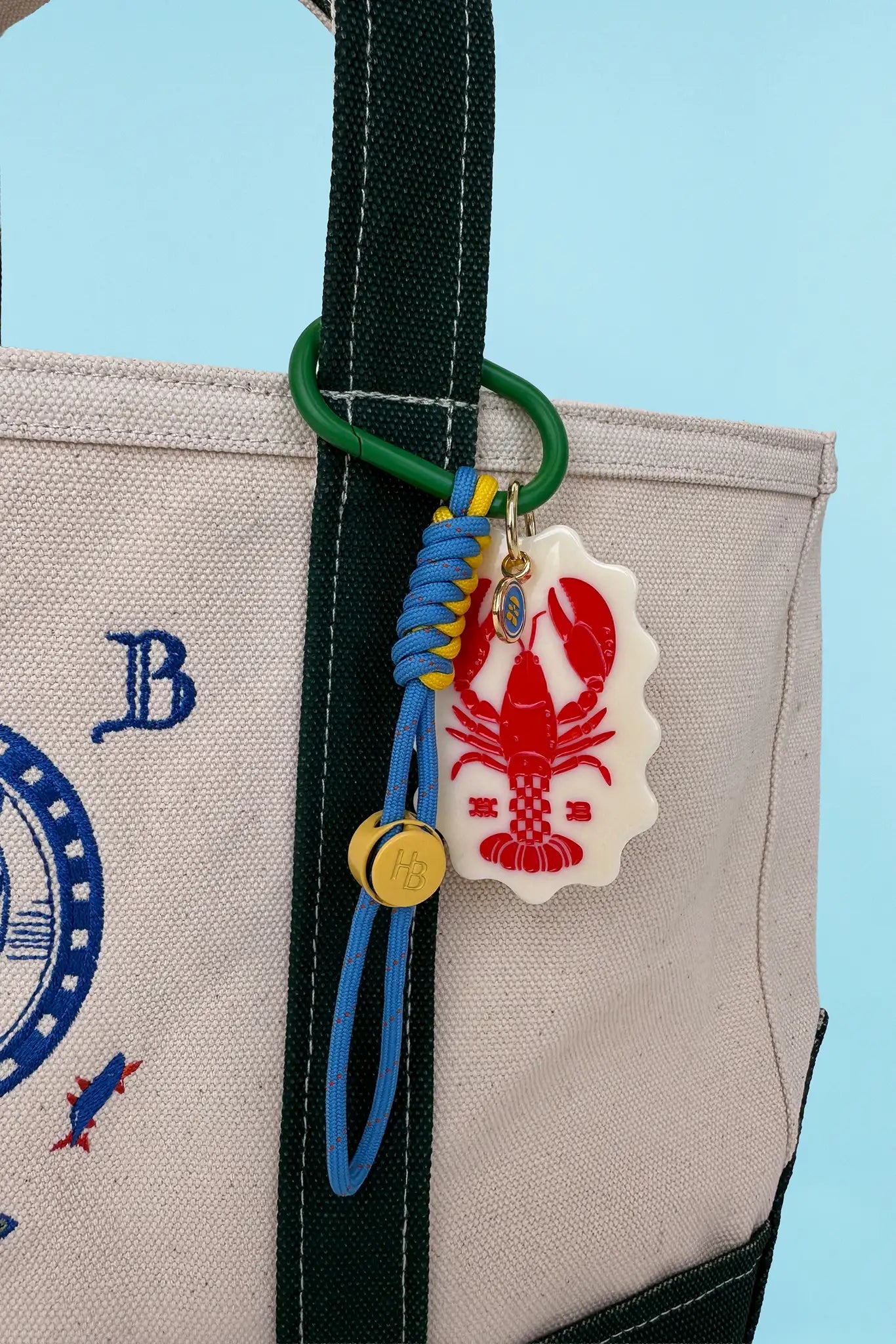 The Lobster Bag Charm on tote bag