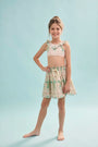 The Rosie Skirt in Pink Trellis paired with matching Kids swimsuit.