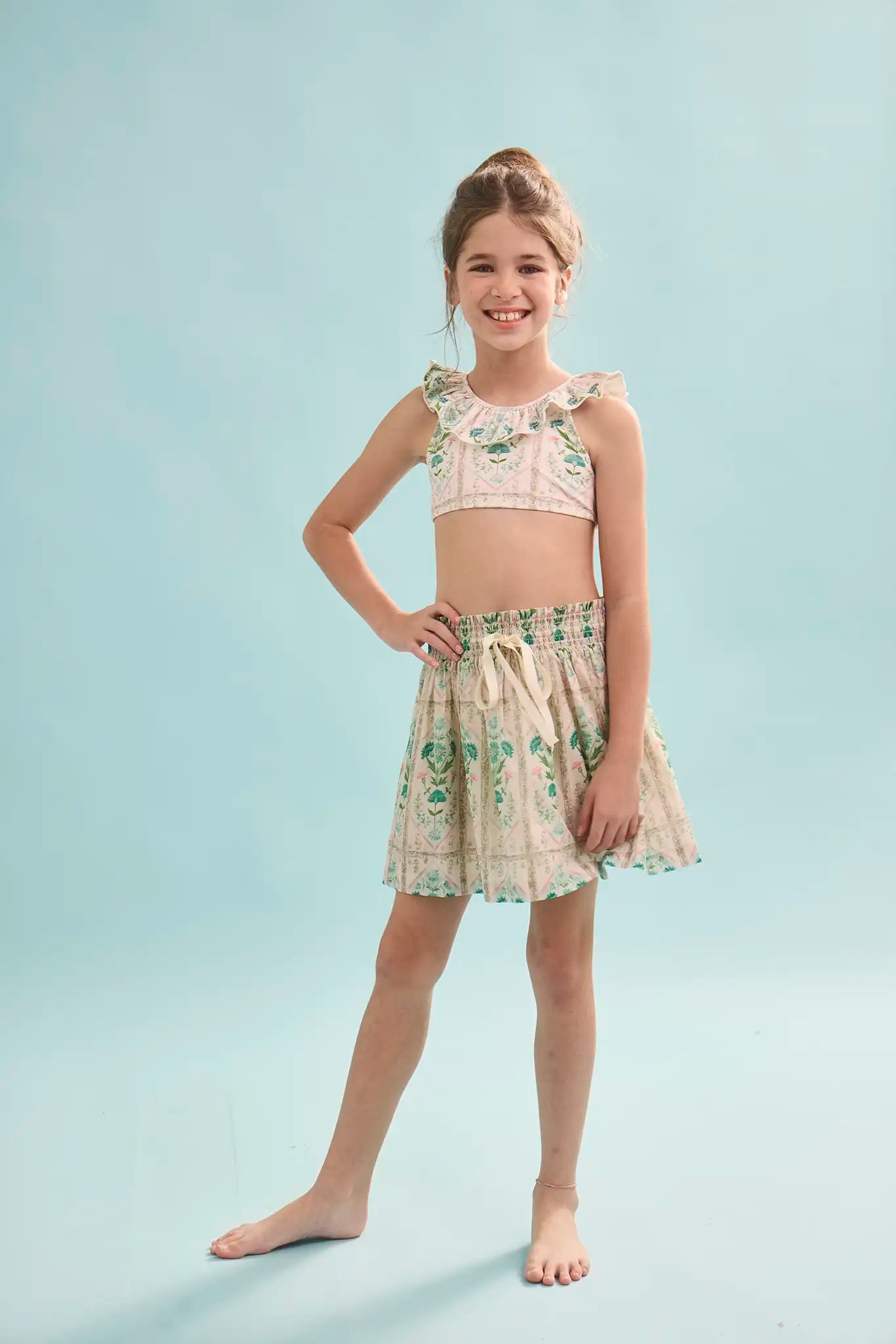 The Rosie Skirt in Pink Trellis paired with matching Kids swimsuit.