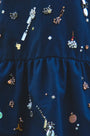 Close up of the Kids Ellie Dress in Atelier Splatter Navy. 
