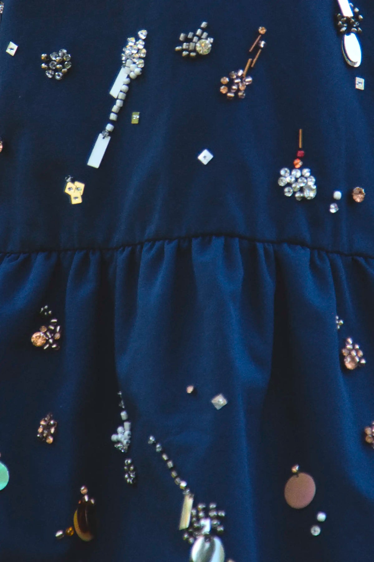 Close up of the Kids Ellie Dress in Atelier Splatter Navy. 