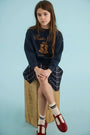 The Kids Pattie Skirt in St. Andrews Check paired with our Kids Heritage Sweatshirt. 