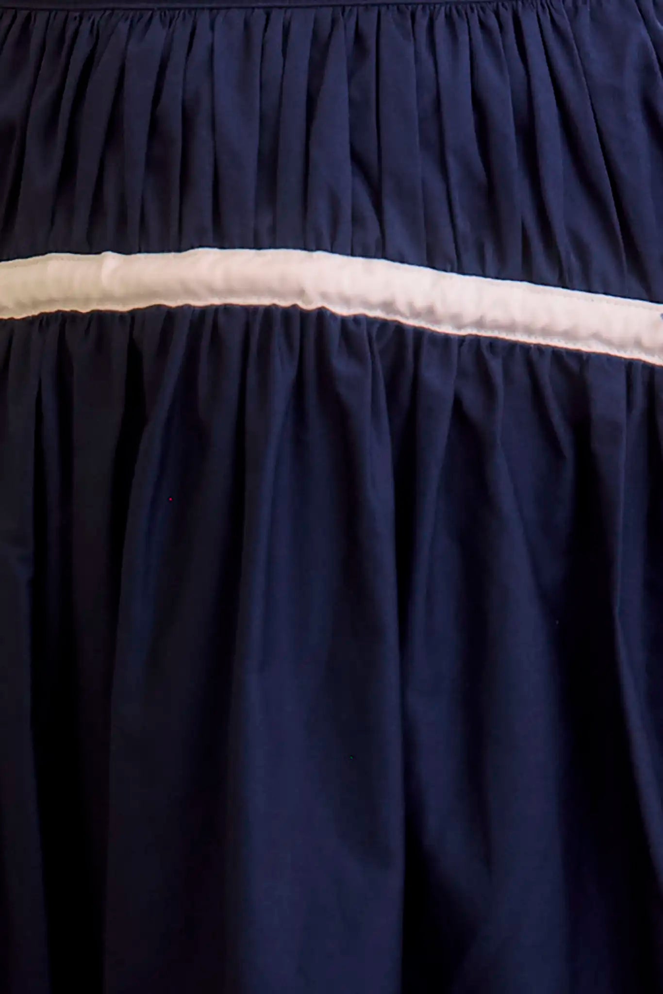 Close up of the Allegra Skirt in navy.