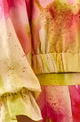 Cropped long sleeve top in yellow and pink tie-dye print with elastic at the sleeves