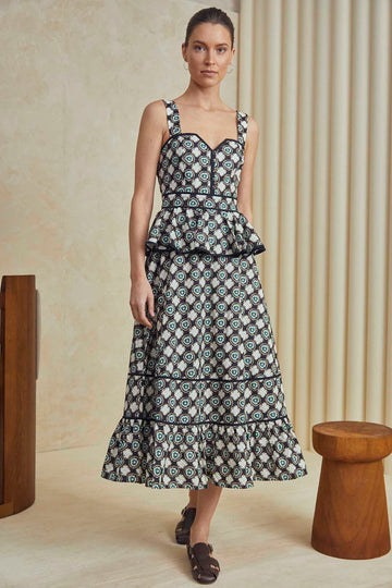 The Lacey is a peplum midi dress with a sweetheart neckline, fitted bodice and a circle cut skirt.