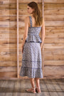 Vine Stripe peplum midi dress with a sleeveless bodice, sweetheart neckline, full circle skirt.