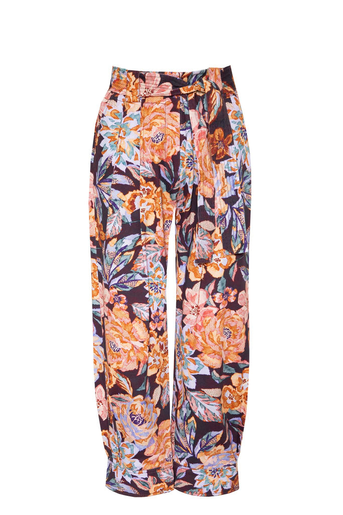 The Lane floral pant has front tucks under the waist, a tapered leg, a cuffed hem and a self-belt.