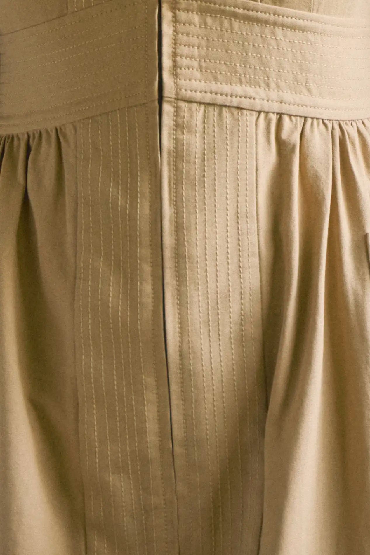 V-neck midi dress with a fitted bodice, full skirt, elbow-length sleeves finish with ties.