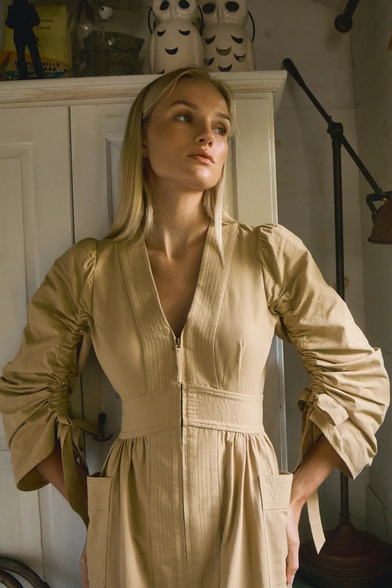 V-neck midi dress with a fitted bodice, full skirt, elbow-length sleeves finish with ties.