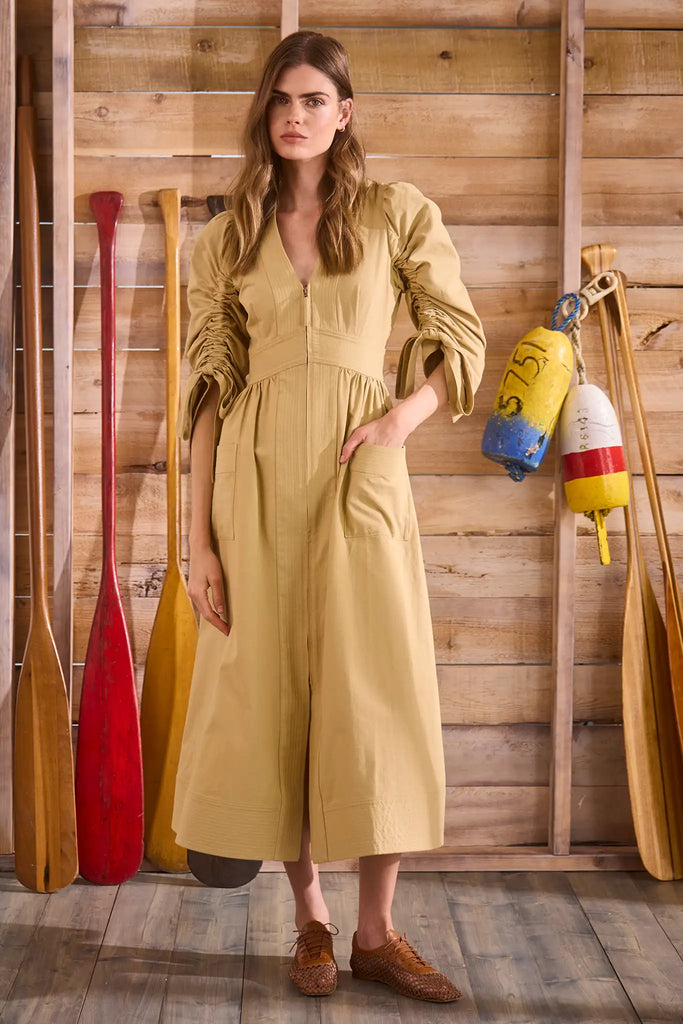 V-neck midi dress with a fitted bodice, full skirt, elbow-length sleeves finish with ties.