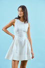 White linen mini dress with structured bustier bodice.