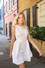 White linen mini dress with structured bustier bodice.