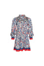 The Lila Dress is a mini with a tie neckline, long sleeves with button cuffs and a color block hem. 