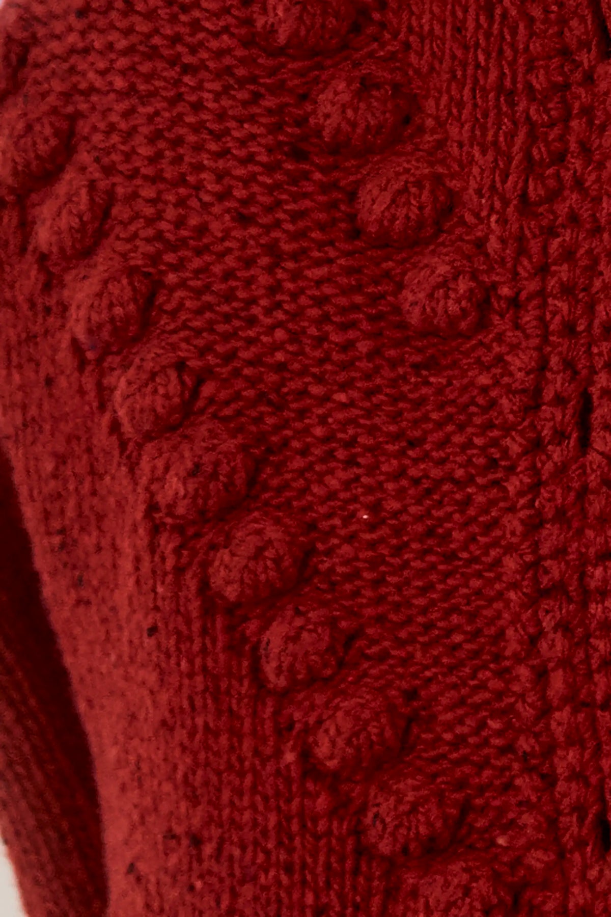 Close up of the Bobble Sweater in Maroon.