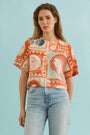 The Maeve Top in lost at sea paired with denim.