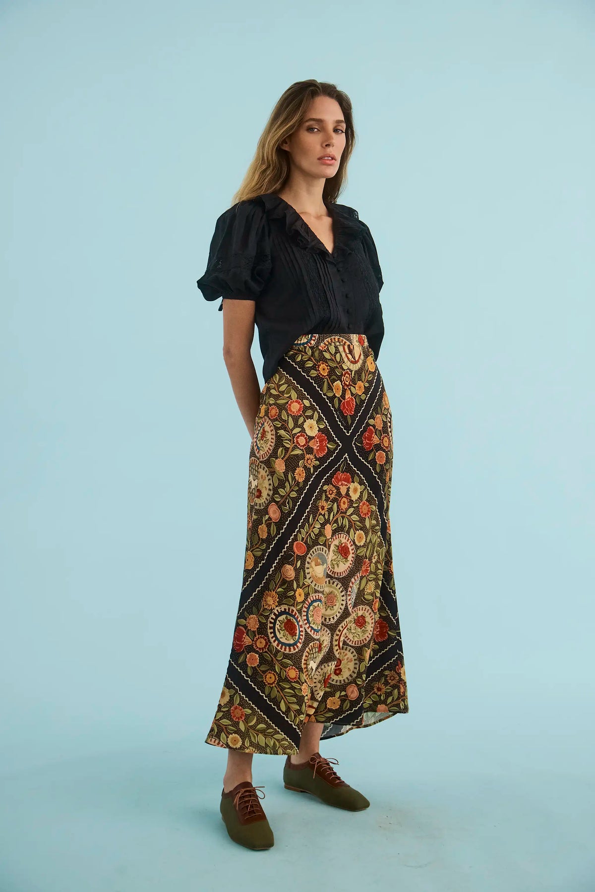 The Mare Top in Onyx paired with the Suki Skirt in Found Heirloom. 
