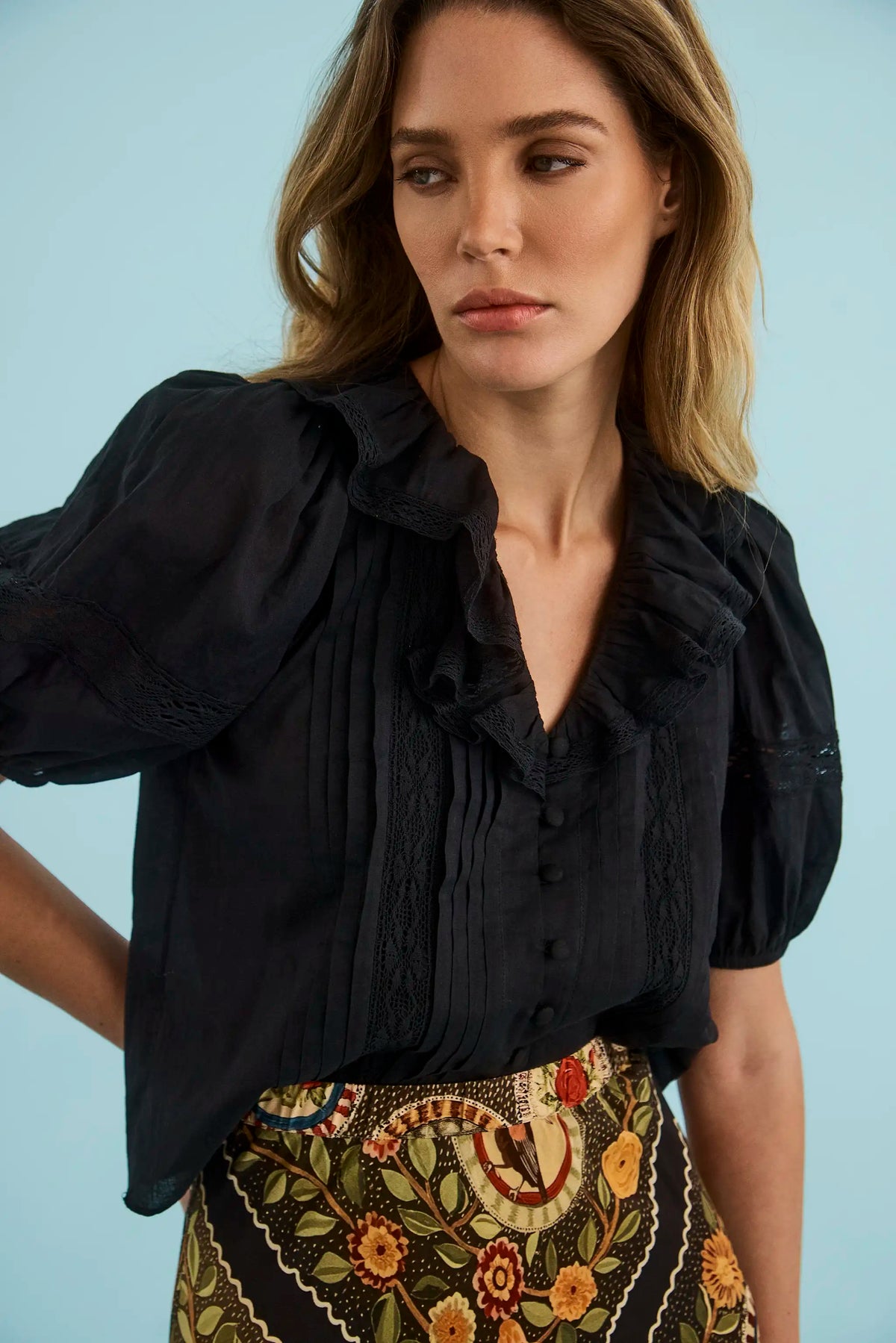 The Mare Top in Onyx paired with the Suki Skirt in Found Heirloom. 