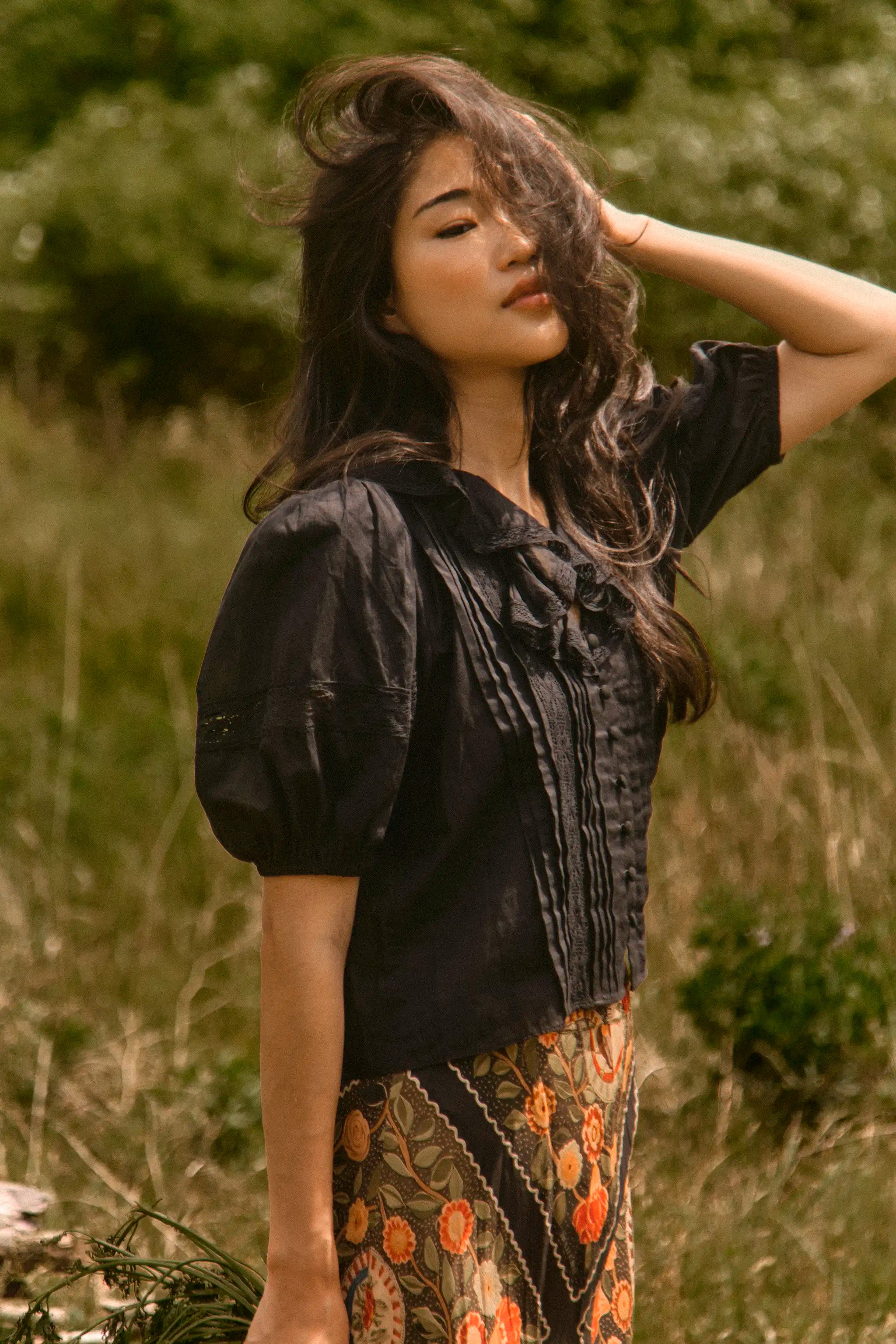 The Mare Top in Onyx paired with the Suki Skirt in Found Heirloom. 
