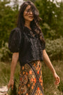 The Mare Top in Onyx paired with the Suki Skirt in Found Heirloom. 