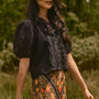 The Mare Top in Onyx paired with the Suki Skirt in Found Heirloom. 