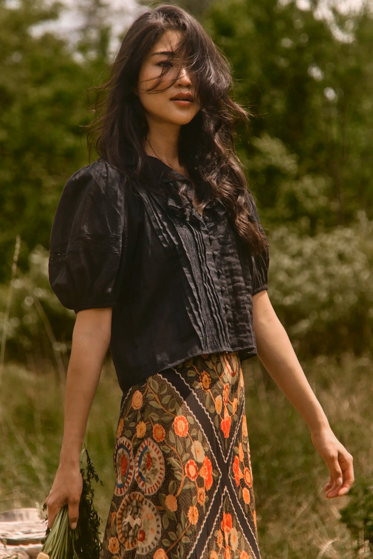 The Mare Top in Onyx paired with the Suki Skirt in Found Heirloom. 