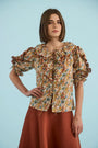 The Marigold Top in Gertrude paired with the Joan Skirt in Rust. 