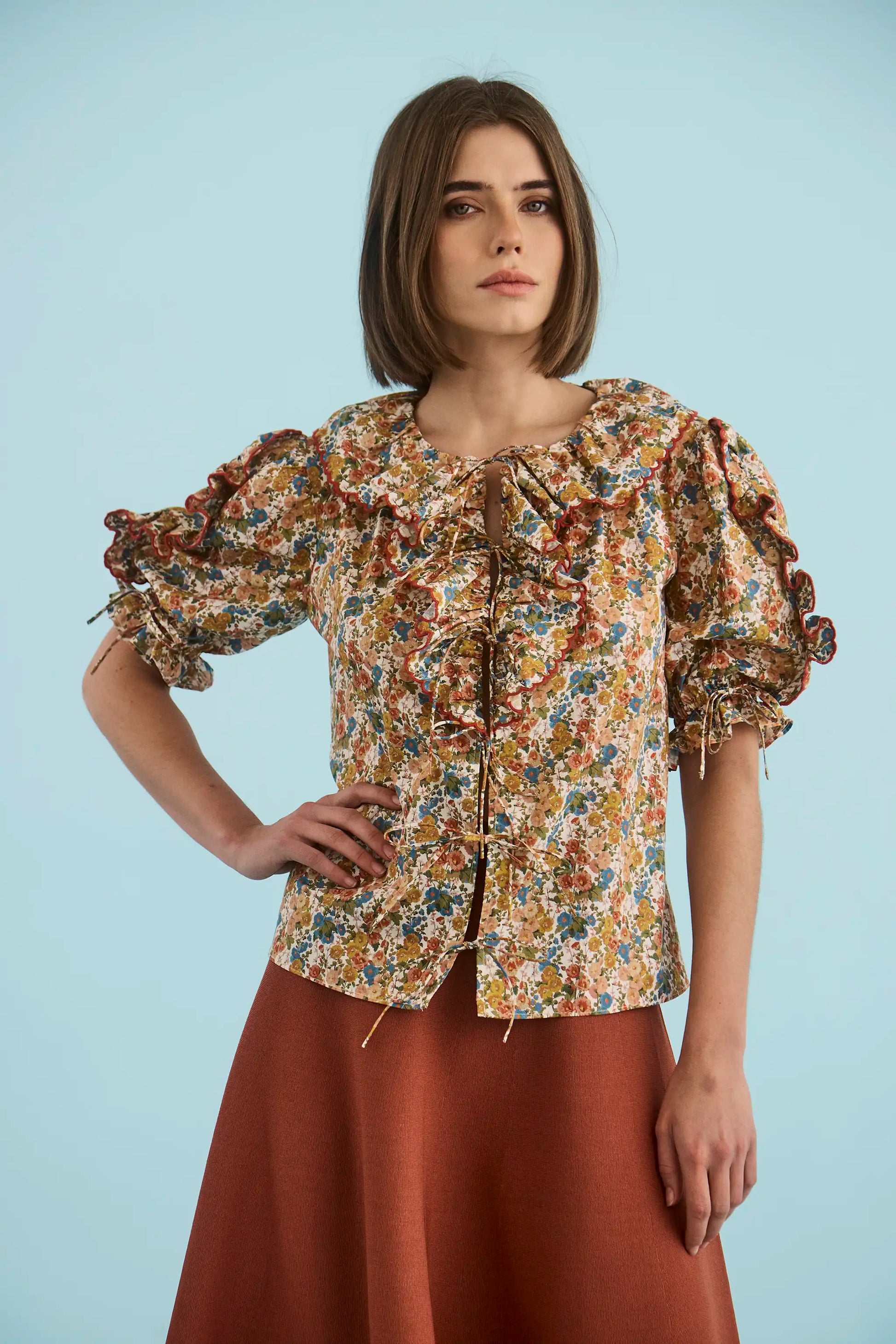 The Marigold Top in Gertrude paired with the Joan Skirt in Rust. 