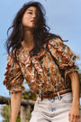 The Marigold Top in Gertrude paired with the Wray Pant in washed blue denim. 
