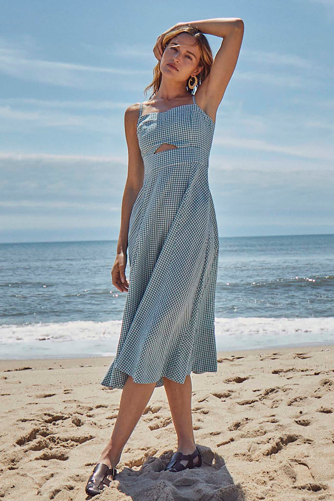 Maxwell is your perfect gingham sundress with a triangle cutout and bow tie back.