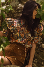 The Mayfair Blouse in Picnic Quilt paired with the Dottie Mini Skirt in Saddle. 